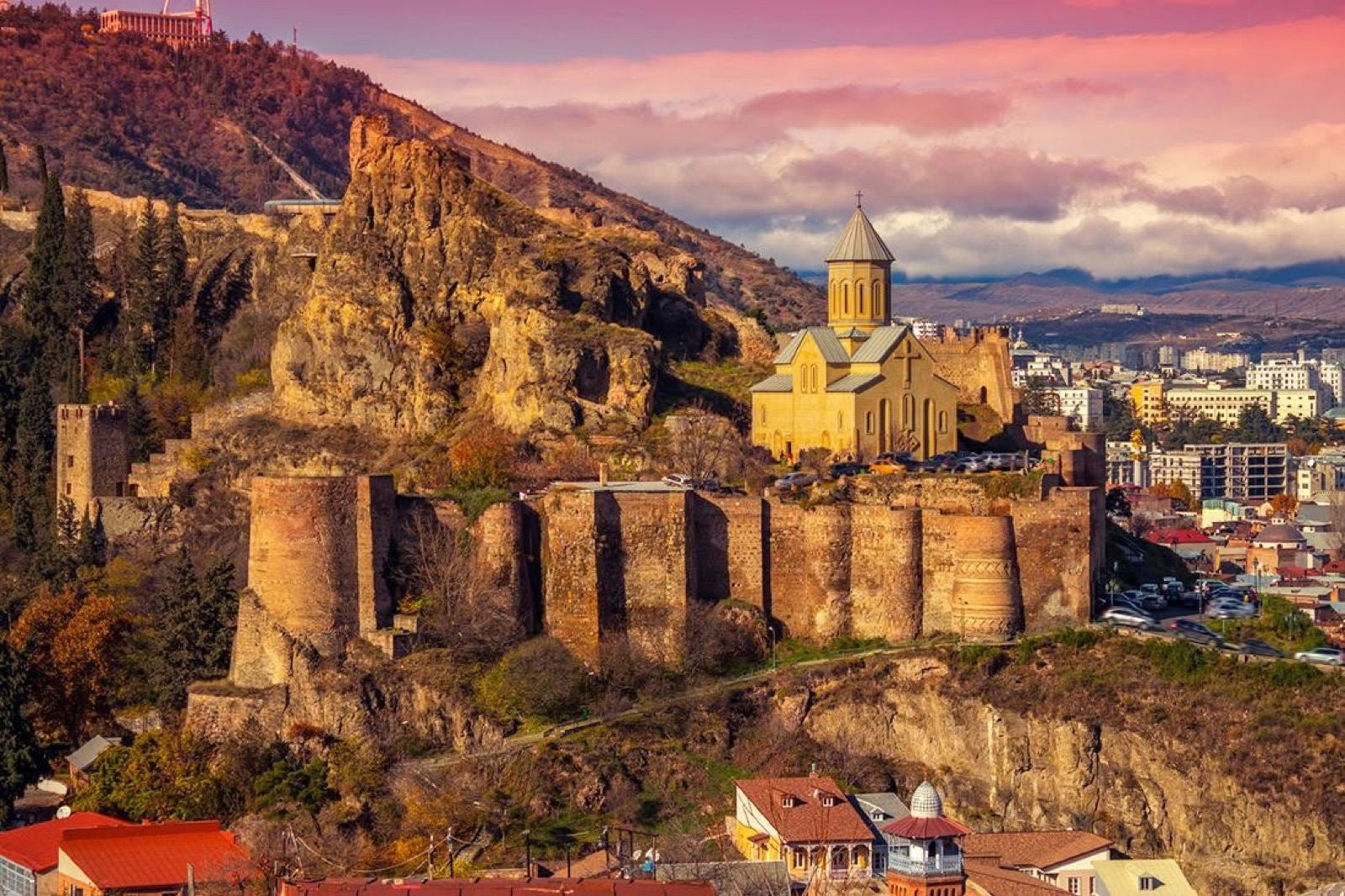 The colourful old-town houses of Tbilisi beneath Narikala fortress