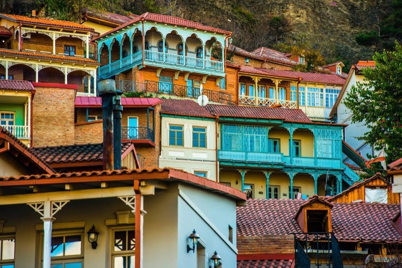 A row of brightly painted old houses in Tbilisi