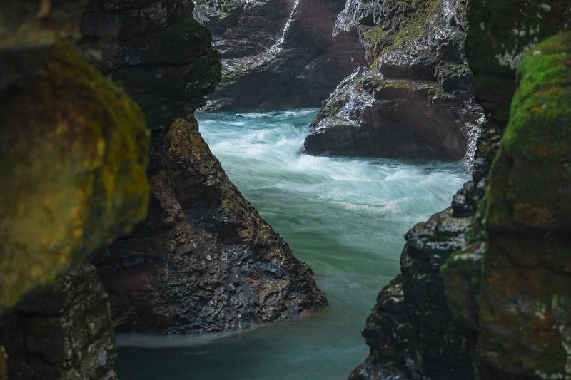 A turquoise river winding through a deep rocky canyon in western Georgia
