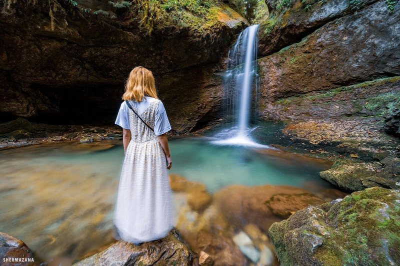 A waterfall cascading through the lush forest of western Georgia